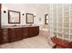Bathroom with double vanity, tile floors, and natural light from a large window at 4670 N 600 E, Franklin, IN 46131