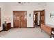 A spacious bedroom with carpeted floors, hardwood trim, ceiling fan and multiple closets at 4670 N 600 E, Franklin, IN 46131