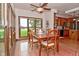 Sunlit dining area boasts wood floors and scenic outdoor views at 4670 N 600 E, Franklin, IN 46131