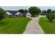 Charming brick home with attached garage, long driveway, and barn set on expansive lawn and beautiful landscaping at 4670 N 600 E, Franklin, IN 46131