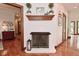 Close up of the brick fireplace with wooden mantle at 4670 N 600 E, Franklin, IN 46131
