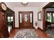 Welcoming foyer with hardwood floors, elegant front door with sidelights, and a decorative rug at 4670 N 600 E, Franklin, IN 46131