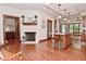Open-concept living room with a white brick fireplace and a view into the kitchen at 4670 N 600 E, Franklin, IN 46131
