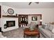 Comfortable living room with white brick fireplace, plush seating, and natural light at 4670 N 600 E, Franklin, IN 46131