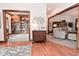Inviting living room with hardwood floors, a cozy sitting area, and a library through the doorway at 4670 N 600 E, Franklin, IN 46131