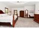 Large bedroom with a ceiling fan, lots of light, and neutral carpeted floors at 4670 N 600 E, Franklin, IN 46131