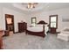 Spacious main bedroom with tray ceiling, a sitting area and a large walk-in closet at 4670 N 600 E, Franklin, IN 46131