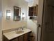 This bathroom features a vanity with storage and a shower at 4673 S 400 W, New Palestine, IN 46163