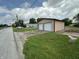 Property includes a two-car garage that complements the main house, near train tracks at 4673 S 400 W, New Palestine, IN 46163