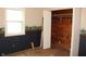 Bedroom with a closet, blue wainscoting, and bear-themed wallpaper at 515 Hawthorne Ave, Anderson, IN 46011