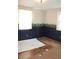 Bedroom with dark blue walls, wood trim, and bear-themed wallpaper at 515 Hawthorne Ave, Anderson, IN 46011