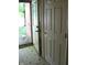 Entryway with tile floor and natural light streaming through a storm door at 515 Hawthorne Ave, Anderson, IN 46011