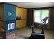Spacious living room with fireplace and exercise bike at 515 Hawthorne Ave, Anderson, IN 46011