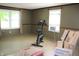 Bright living room with windows and exercise bike at 515 Hawthorne Ave, Anderson, IN 46011