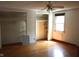 Bedroom boasting hardwood floors, ceiling fan, and access to closets at 515 Hawthorne Ave, Anderson, IN 46011