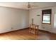 Bedroom featuring hardwood floors, a ceiling fan, and a window at 515 Hawthorne Ave, Anderson, IN 46011