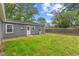 Back exterior featuring grassy backyard at 5367 Penway St, Indianapolis, IN 46224
