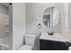 Bathroom featuring modern vanity with a mirror and an updated shower at 5367 Penway St, Indianapolis, IN 46224