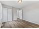 Light-filled bedroom boasts hardwood floors, closet, and freshly painted neutral walls at 5367 Penway St, Indianapolis, IN 46224