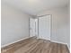 Bedroom featuring a closet, wood-look floors, and neutral paint at 5367 Penway St, Indianapolis, IN 46224