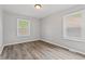 Bright bedroom featuring hardwood floors, neutral walls and window with natural light at 5367 Penway St, Indianapolis, IN 46224