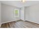 Bedroom with hardwood floors and neutral gray paint at 5367 Penway St, Indianapolis, IN 46224