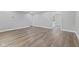 Spacious living room featuring light gray walls and new flooring at 5367 Penway St, Indianapolis, IN 46224