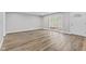 Bright living room offers hardwood floors, fresh paint, and a large picture window at 5367 Penway St, Indianapolis, IN 46224