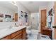 Bright bathroom featuring a shower, vanity and ample lighting at 5515 Gateridge Ln, Indianapolis, IN 46237