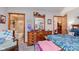 Cozy bedroom featuring an ensuite bathroom and a quaint bedroom area at 5515 Gateridge Ln, Indianapolis, IN 46237