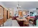 Bright dining area featuring wood trim, access to the bathroom and decorated with a wooden table and comfortable seating at 5515 Gateridge Ln, Indianapolis, IN 46237