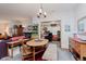 A cozy dining area with a wooden table and view into another room adds charm to this inviting living space at 5515 Gateridge Ln, Indianapolis, IN 46237