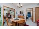 Bright dining area with a wooden table, chairs, and seamless flow to other rooms at 5515 Gateridge Ln, Indianapolis, IN 46237