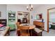Bright dining area with a wooden table, chairs, and seamless flow to other rooms at 5515 Gateridge Ln, Indianapolis, IN 46237