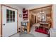 Inviting entryway leading into a dining area and bathroom, featuring light-colored walls and wood trim details at 5515 Gateridge Ln, Indianapolis, IN 46237
