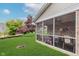 Screened porch features a cozy table setting and well-manicured lawn at 5515 Gateridge Ln, Indianapolis, IN 46237