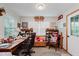 Bright home office with natural light, a large desk, and ample storage shelving offers a productive workspace at 5515 Gateridge Ln, Indianapolis, IN 46237