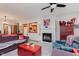 Cozy living room featuring a fireplace and seamless flow to the kitchen at 5515 Gateridge Ln, Indianapolis, IN 46237