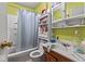 A bathroom with a toilet, sink, and shower at 5614 Regency Dr, Indianapolis, IN 46224