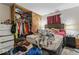 A bedroom with a large bed and closet space at 5614 Regency Dr, Indianapolis, IN 46224