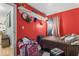 Bright red bedroom featuring ample storage at 5614 Regency Dr, Indianapolis, IN 46224