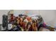A bedroom contains a bed, desk, and other furniture and is in need of repair at 5614 Regency Dr, Indianapolis, IN 46224
