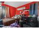 Red bedroom with dark accents and window at 5614 Regency Dr, Indianapolis, IN 46224