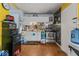 A compact kitchen with white cabinets and stainless steel appliances at 5614 Regency Dr, Indianapolis, IN 46224