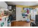 Kitchen features black and white wall paper, and white appliances at 5614 Regency Dr, Indianapolis, IN 46224