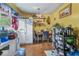 A view of the kitchen with wood floor, white appliances, and yellow walls at 5614 Regency Dr, Indianapolis, IN 46224