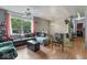 Comfortable and functional living area with natural light, ceiling fan, and comfortable seating at 5614 Regency Dr, Indianapolis, IN 46224