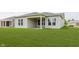 Well maintained backyard with green lawn and covered patio area, perfect for outdoor entertaining and relaxation at 5673 Stetson Dr, Whitestown, IN 46052