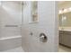 Close-up of the bathroom's shower, including a built-in seat and fixtures at 5673 Stetson Dr, Whitestown, IN 46052