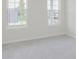 Bedroom features two windows and neutral-colored carpet at 5673 Stetson Dr, Whitestown, IN 46052